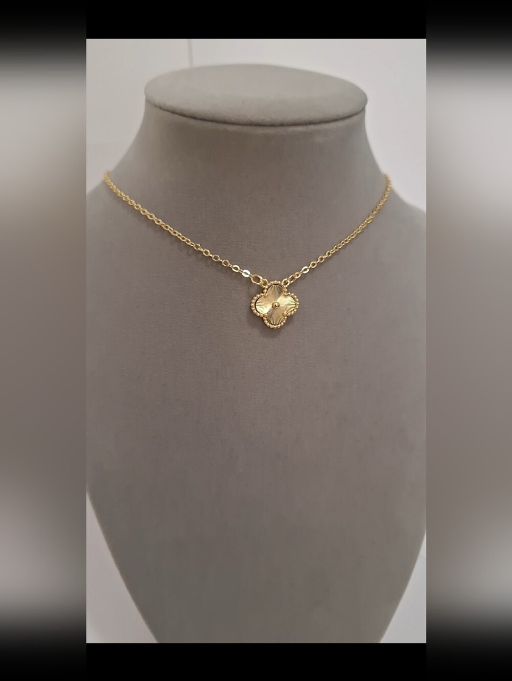 Double sided gold-filled single clover necklace.